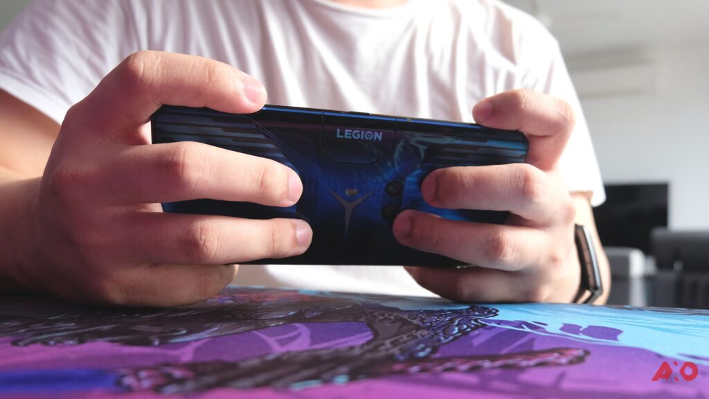 gaming holding the Lenovo Legion Phone Duel